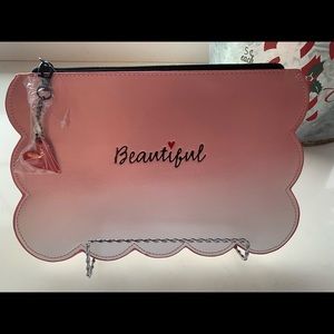 Cosmetic pouch, pencil case, make up bag.
